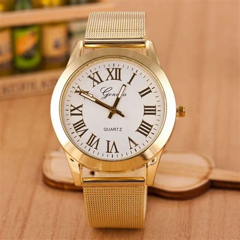 gold watch with roman numerals